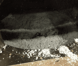 the inside of hyrda pulper emulsifying cartons into a gray slurry consisting of paper, plastic, and aluminum.