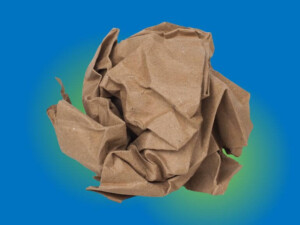 A scrunched up ball of kraft paper over a blue and green gradient